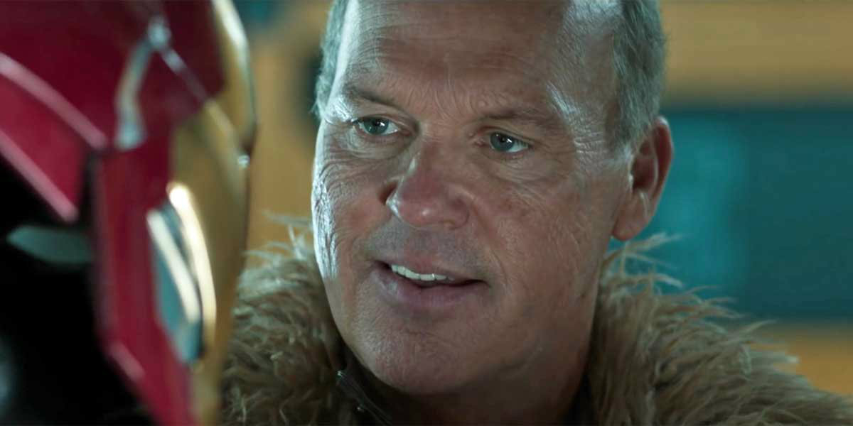 Michael Keaton as Vulture looking at an Iron-Man mask.