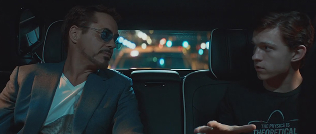 Peter Parker and Tony Stark looking at each other in the back seat of a car.