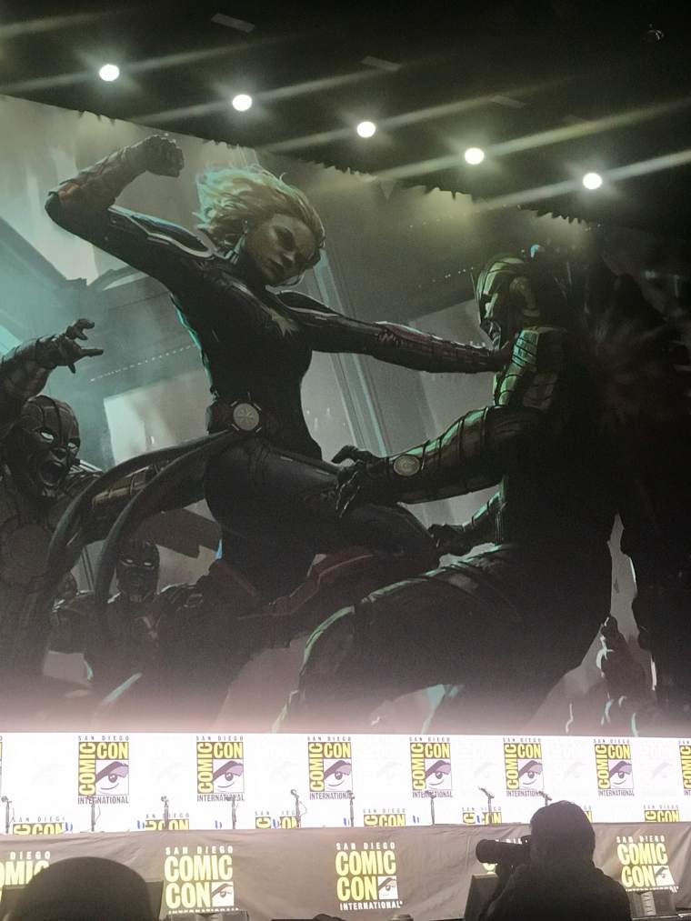 Captain Marvel concept art of her fighting someone in armor.