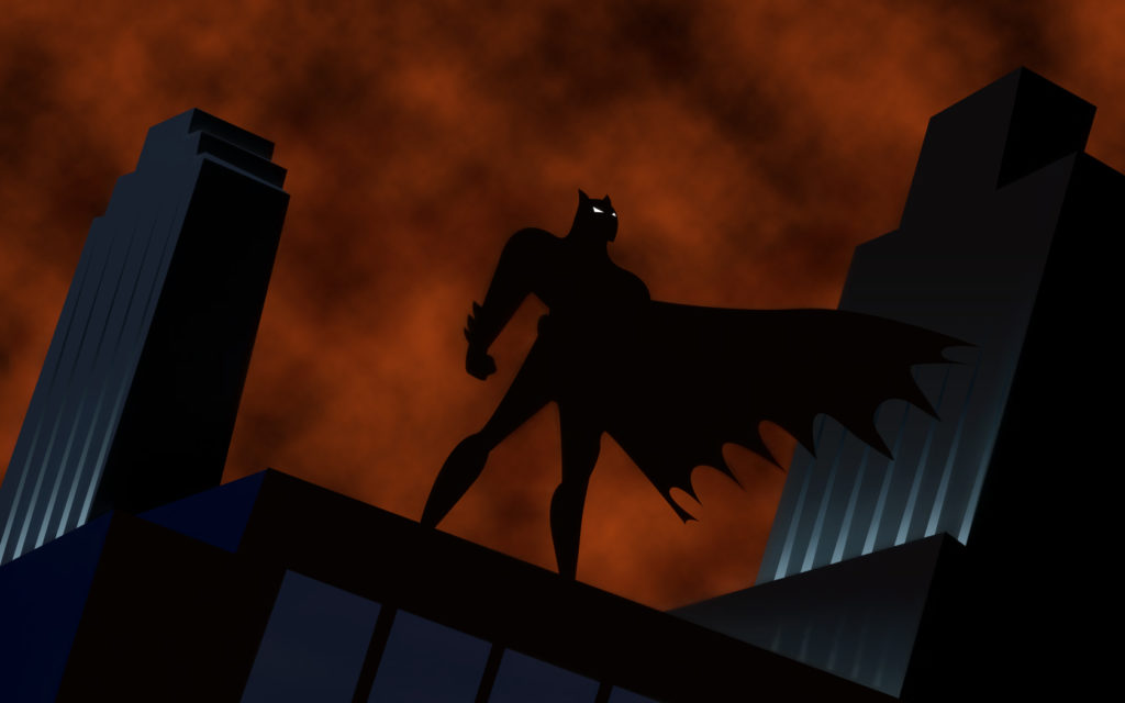 Batman in silhouette standing on a building from Batman the Animated Series.